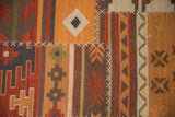 Patchwork Kilim rug displaying white cross-hatch stitches and diverse geometric patterns.