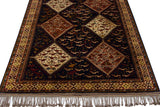 Angled view showing the lustrous pile and repeating medallions with bird motifs on a vintage Indian rug.