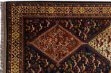 Corner of a vintage Indian rug with a geometric border, stepped medallion, and stylized bird motifs.