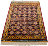 Vintage Indian rug with a lustrous Caucasian geometric design in navy blue, gold, and red.