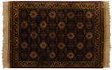 Ivory fringe, gold meandering vine border, and navy geometric floral motifs.
