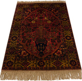 Traditional Bakhtiari tree-of-life motif with navy vase, floral vines, birds on dusty red.