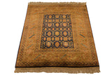 Corner of vintage Indian rug, navy geometric floral field, wide gold border with vinery.
