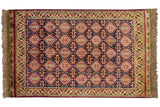Vintage Indian rug with a Caucasian allover geometric pattern in navy blue, gold, and wine red.