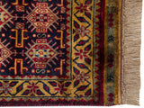 Gold floral border, intact side cord, and full ivory fringe on a vintage Indian Caucasian design rug.