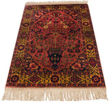 Angled view of a vintage Indian Bakhtiari rug, highlighting its rich, lustrous pile and ivory fringe.