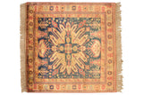 Ornate square Indian Kazak rug with multi-tiered floral blossoms in navy, rust, and ivory.