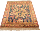Vintage Indian Kazak rug showing rust, gold, and teal multi-tiered floral patterns.