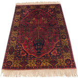 Upper right corner of Bakhtiari rug, with original ivory fringe and intricate gold floral border.