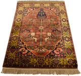 Angled view of a vintage Indian Bakhtiari rug, showcasing the lustrous, full pile.