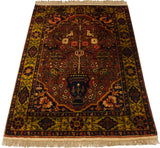 Vintage Bakhtiari design rug from an angle, showing its tree-of-life pattern and lustrous pile.