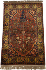 Bakhtiari design rug upper corner with gold floral border, dusty red field, and high luster pile.