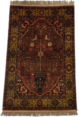 Navy blue vase and floral blossoms on vintage Indian Bakhtiari rug.