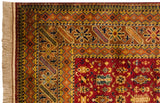 Fringe, deep red field, and geometric Chi-Chi motif borders on the vintage Indian Caucasian rug.