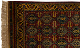 Intact side cord selvage and ivory fringe on a vintage rug with a gold floral border.