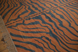 Horizontal seam across the Vintage Tiger Kilim carpet's rust and charcoal tiger stripes.
