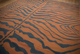 Handwoven vintage tiger kilim with terracotta and charcoal abrashes, distinct seam.