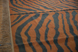 Hand woven vintage Tiger Kilim carpet's pale rust and charcoal abrash stripes with fringe.