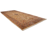 Angled view of an oversize vintage Kerman carpet, highlighting its grand scale and European floral design.