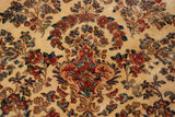 Plush wool pile of a vintage Kerman rug with millefleur bouquets in red, blue, and gold.