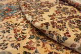 Folded view of a vintage Kerman carpet revealing its deep, plush pile and colorful floral bouquets.