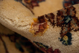 The original full pile height and dense hand-knotted texture of a vintage Kerman carpet.