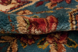 Dense, full pile of a hand-knotted Kerman carpet in sky blue and cochineal red.