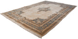 Vintage Kerman carpet's ivory field with blue Rococo floral stylization and detailed main border.