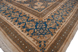 Ivory, sky blue, and gold floral main border detail of vintage Kerman rug.