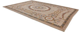 Vintage Spanish Savonnerie design carpet corner with floral roundel and rose garlands on a soft beige field.