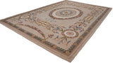 Corner of Vintage Spanish Savonnerie rug, showcasing original selvage and green leaf border.