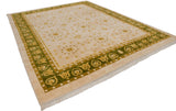 Art Deco Indian rug corner, olive green border, dusty gold motifs, ivory field.