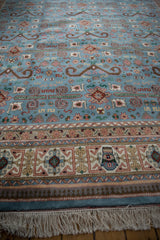 Secure ivory fringe and colorful patterned border of a vintage Indian Shirvan carpet.
