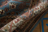 Rolled border of vintage Indian Shirvan carpet with blue, ivory, blush floral motifs and plush pile.