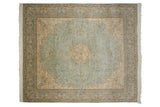 Vintage Kerman design square carpet with a starburst medallion on a mint green mille fleur field.