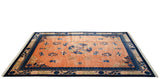 Angled perspective of a vintage Peking carpet's copper field with blue floral and cloud-band motifs.