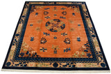 Angled view of a vintage Peking carpet with potted plants and floral sprays on its pale copper field.