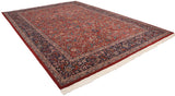 Elaborate navy border arabesques and white fringe detail on vintage Chinese Isfahan rug.