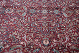 The thick, even pile highlights the intricate floral vinery of this Kashan design rug.