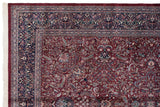 Intricate navy blue floral border and original side cord selvage on a vintage Indian Kashan carpet.