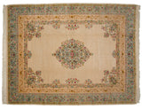 Corner view of a vintage Bulgarian carpet with floral spandrels and a Rococo-style powder blue border.