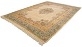 Angled view of a Bulgarian carpet showing the full floral medallion and multi-layered borders.