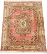 Dusty pink Aubusson design carpet with ivory cameo center medallion and roses.