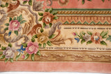 Plush border of the Aubusson design rug, featuring dusty pink roses, green leaves, and ivory motifs.