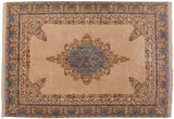 Detailed Rococo stylized floral vinery on an ivory Indian Kerman carpet with sky blue medallion.