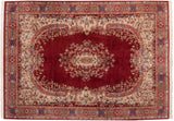 Curvilinear floral vinery on ivory and cherry red field of a vintage Indian Sarouk rug.