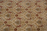 A detail of the repeating pictorial design featuring copper lions and blue motifs on a full ivory pile.