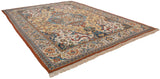 Vintage Indian Polonaise carpet viewed from an angle, showing its elaborate floral pattern and rust border.