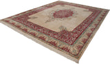 Top left corner of Indian Kerman rug: scalloped ivory field, raspberry red Safavid-inspired border.