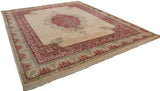 Vintage Indian Kerman carpet corner, raspberry red border with Safavid dragon motifs and fringe.